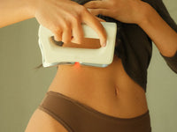 FasciaWave held on the lower belly