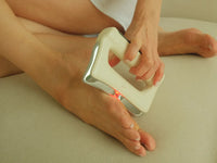FasciaWave held on the top of the foot