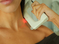 FasciaWave held against the side of the neck